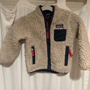Patagonia Beige Sherpa Jacket with Navy Trim and Red Accents